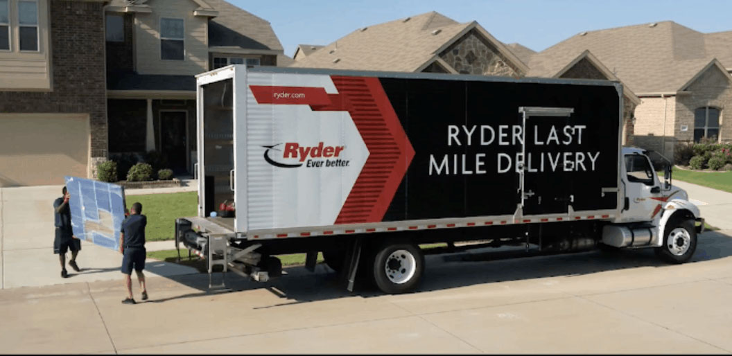 Ryder Last Mile Truck and Ryder Employees Dropping off a large shipment.